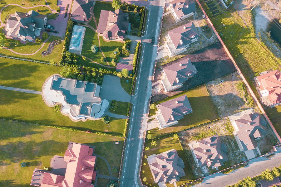 Contact - Aerial Abstract View of a Residential Neighborhood in Cypress, Texas at Sunset